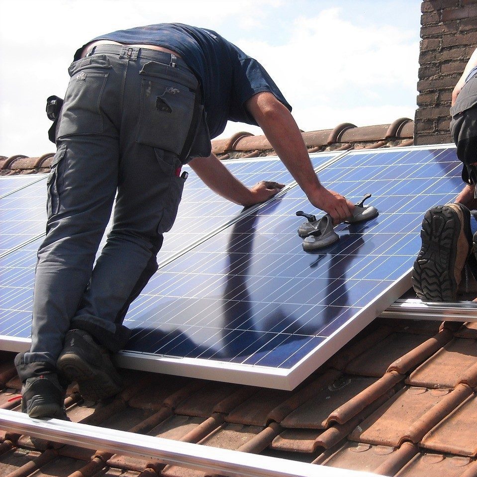 Solar panels being installed on roof