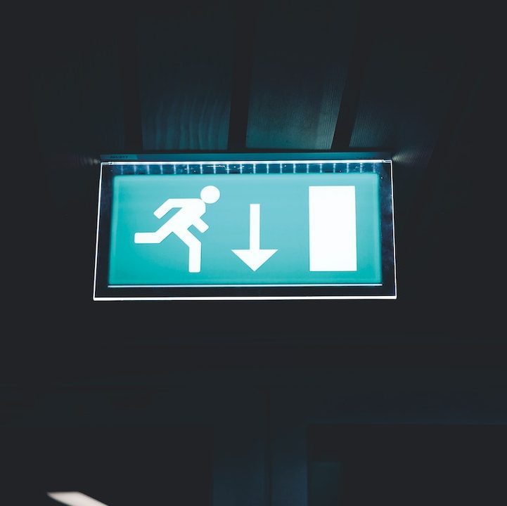 Emergency Exit sign lit up with directional arrow