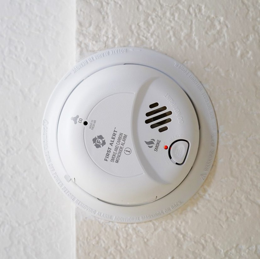 Smoke detector with writing describing use